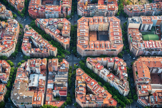 Barcelona architecture, high angle view of the city typical urban grid, Spain. Aerial helicopter view