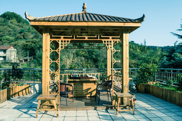 Chinese-style wooden gazebo for tea ceremony.