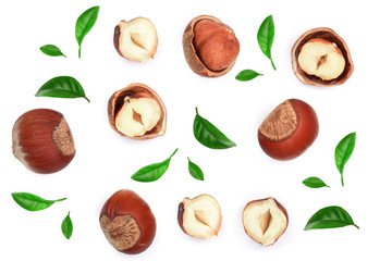 Hazelnuts with leaves isolated on white background. Top view. Flat lay