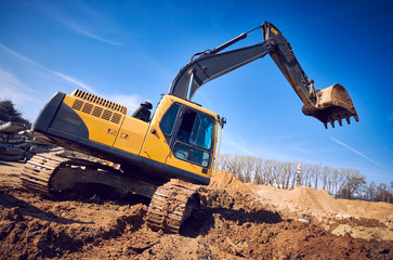 excavator loader machine earthmoving soil at construction site