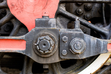Chassis of the old train. Steel heavy wheels of a steam locomotive.