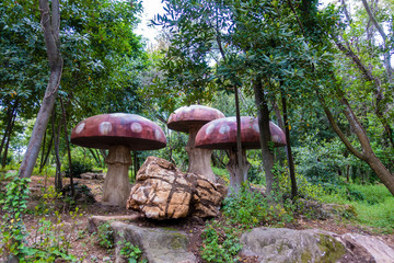 Red wooden mushrooms on a playground