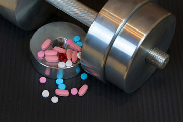 Dumbells, vitamins, amino acids, minerals for sports