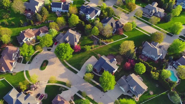 Beautiful neighborhoods, homes, Springtime aerial view at sunrise.
