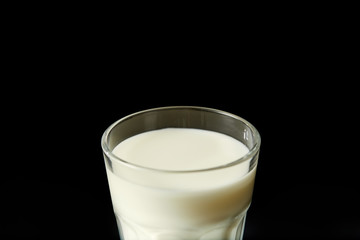 closeup view of milk glass isolated on black background