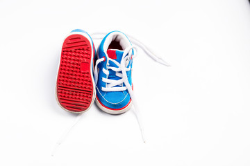 Children's sneakers on a white background, top view.