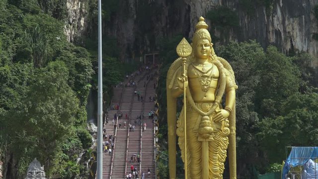Batu Cave Hindu temple and Lord Murugan statue - October 2017: Kuala Lumpur, Malaysia