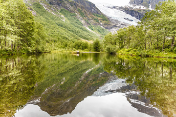Fototapeta na wymiar Boyabreen Glacier and lake in Norway