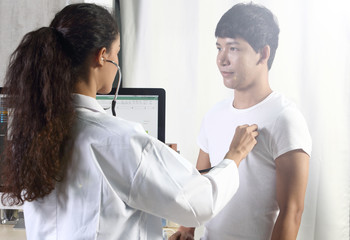 Fototapeta premium Doctor Nurse in white blue shirt with stethoscope and rubber gloves
