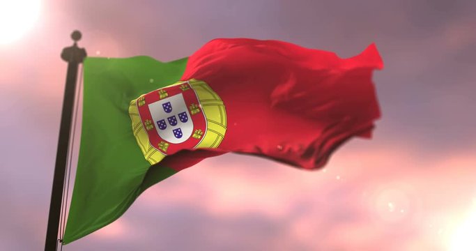 Flag of Portugal waving at wind in slow at sunset, loop