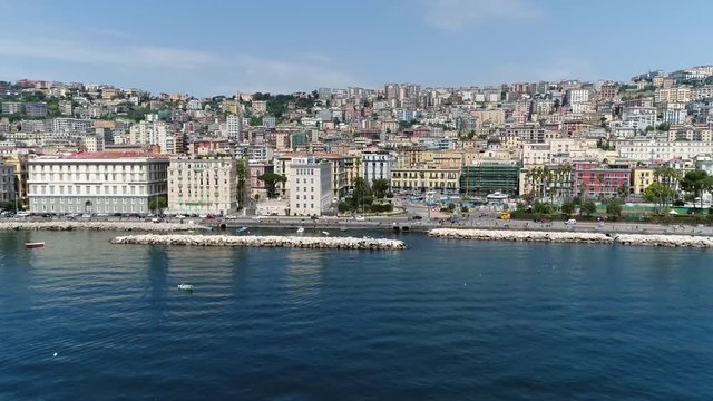 Aerial bird view footage of Naples boulevard in Italian Napoli is third-largest municipality in Italy after Rome and one of largest metropolises on Tyrrhenian Sea which is part of Mediterranean Sea 4k