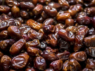 many date fruits on the table background