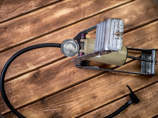 bicycle pedal food pump on the wooden table overhead view