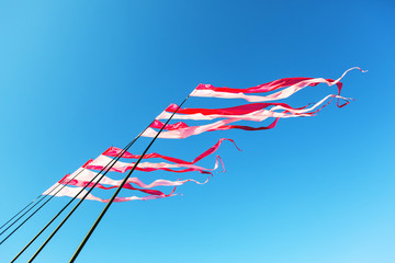 festival ribbons and flags fluttering downwind