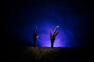 Foto op Plexiglas Halloween concept, zombie hand rising out from the ground or zombie hand coming out of his grave © zef art