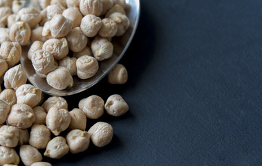 close-up dried chickpeas on a spoon