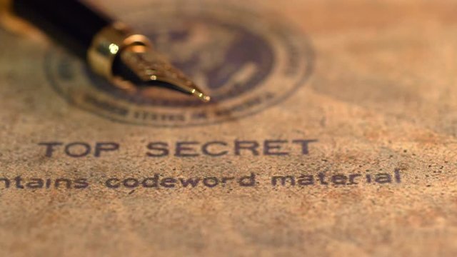 Fountain pen on top classified document