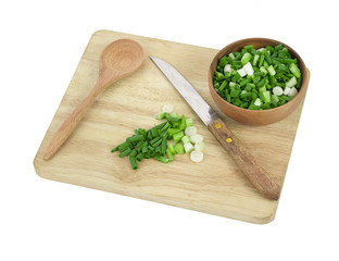 Fresh green onion on the wooden board