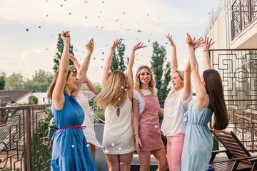 Girls Party. Beautiful Women Friends on the balcony Having Fun At Bachelorette Party. They are...