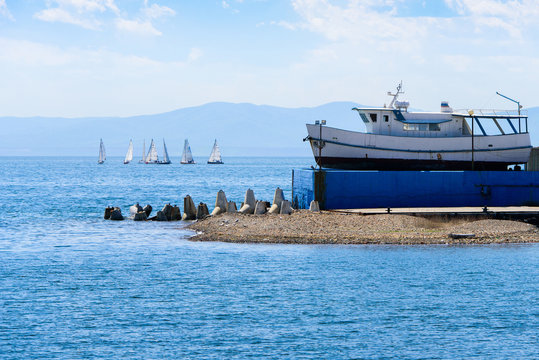Fototapeta Sea landscape. The boat and yachts on water.