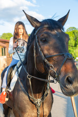 beautiful girl is riding a horse