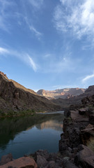 Campsite at dawn. Colorado River runs through Grand Canyon providing exciting whitewater rafting and incredible views along the way. Numerous side canyons can be hiked, often to beautiful waterfalls.