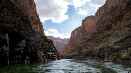 Fototapeta na wymiar Colorado River runs through Grand Canyon providing exciting whitewater rafting and incredible views along the way. Numerous side canyons can be hiked, often to beautiful waterfalls.