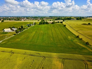 Fototapeta premium Aerial view over farming field in Sweden during summer