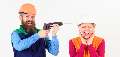 Builder, repairman makes hole in female head.