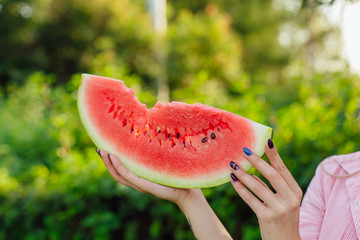 Close up watermelon in woman's hands