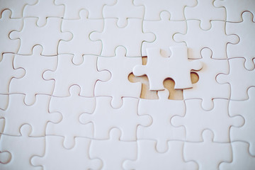 Fototapeta premium White jigsaw puzzle