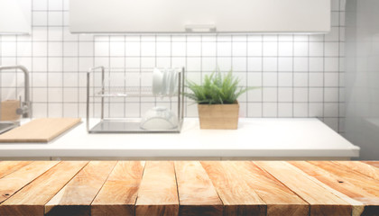 Wood table top on blur kitchen room background .For montage product display or design key visual