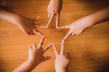 Hands Connecting To Star Shape Teamwork Stacking Hand Concept