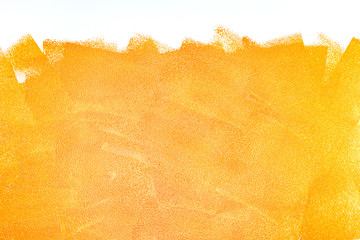 orange acrylic paint roller strokes texture on white wall