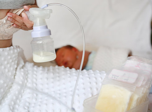 Mother pumped breast milk from the breast
