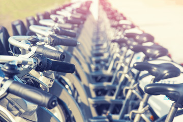 Close up of rental bicycles on rental station on the street