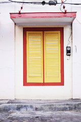 yellow window with a red frame