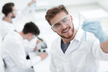 closeup. scientist with beaker