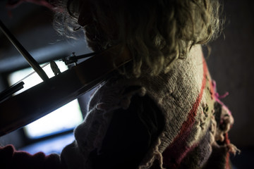 Fototapeta premium Man in a tattered old torn jersey playing a violin