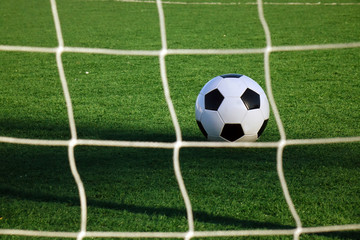 Fototapeta na wymiar Football on a green field