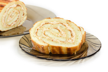 Partly sliced Swiss roll closeup at selective focus