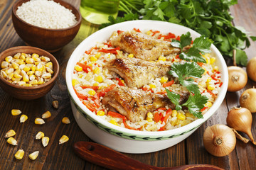 Chicken legs baked with rice and vegetables