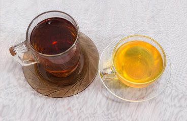 Top view of black and green tea in glass cups
