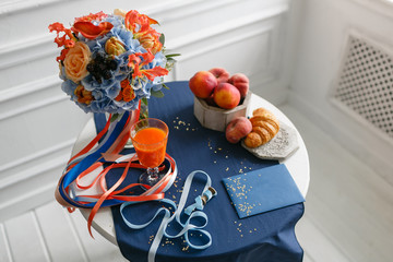 bright and juicy color Wedding bouquet different flowers. Modern bridal bunch with orange tulips, red gloriosa, blue hydrangea, Calla and BlackBerry. breakfast