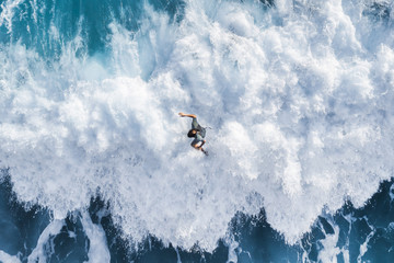 Surfer on the crest of the wave, top view