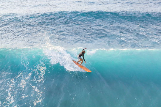 Surfer at the top of the wave, top view