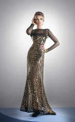 Pretty woman in a long glistening dress