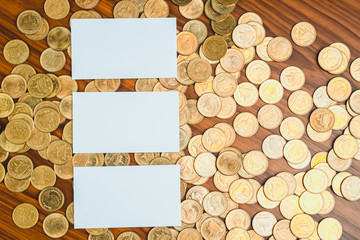 Blank business card or name card with copy space for add text name address and company logo, stack of coin on working table, financial company concept.