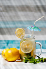 Lemonade with mint and blue umbrella