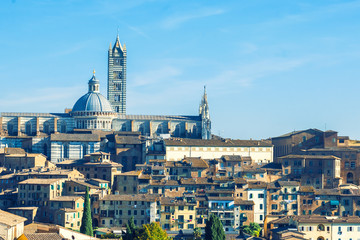 Beautiful medieval town in Tuscany, with view of the Dome & Bell Tower of Siena Cathedral (Duomo di Siena), landmark Mangia Tower and Basilica of San Domenico, Siena,Italy